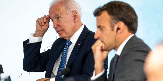 President Joe Biden talks with French President Emmanuel Macron during the final session of the G-7 summit in Carbis Bay, England, Sunday, June 13, 2021. (Doug Mills/The New York Times via AP, Pool)