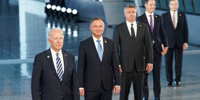 President Joe Biden and other NATO heads of the states and governments pose for a family photo during the NATO summit at the Alliance's headquarters, in Brussels, Belgium, Monday, June 14, 2021.