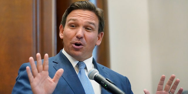 Florida Governor Ron DeSantis gestures while speaking, Monday, June 14, 2021, at the Shul de Bal Harbor, a Jewish community center in Surfside, Florida.  DeSantis visited the South Florida temple to speak out against anti-Semitism and support Israel, while signing a bill that would require public schools in his state to reserve times of silence for children to meditate or pray.  (AP Photo / Wilfredo Lee)