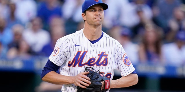 New York Mets starting pitcher Jacob deGrom reacts during the first inning of a baseball game against the Chicago Cubs Wednesday, June 16, 2021, in New York.