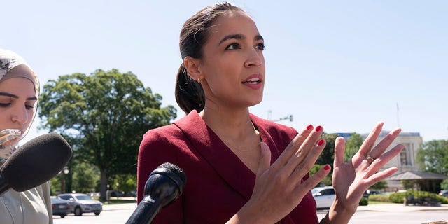 Rep. Alexandria Ocasio-Cortez, D-N.Y., speaking with reporters on Capitol Hill in June.