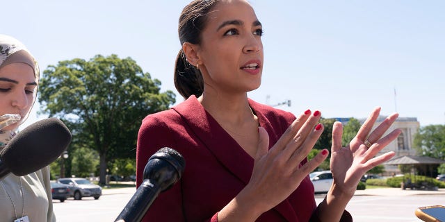 Rep. Alexandria Ocasio-Cortez, D-N.Y., speaking with reporters on Capitol Hill in June.