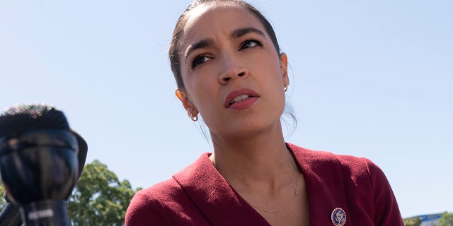 Rep. Alexandria Ocasio-Cortez, D-N.Y., speaks with reporters, Thursday, June 17, 2021, as she arrives on Capitol Hill in Washington. (AP Photo/Jacquelyn Martin)
