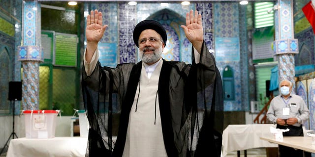 June 18, 2021: Ebrahim Raisi, a candidate in Iran's presidential elections waves to the media after casting his vote at a polling station in Tehran, Iran. (AP Photo/Ebrahim Noroozi)
