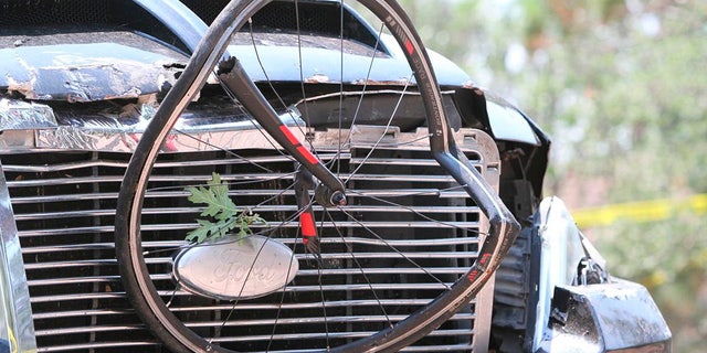 In this Saturday, June 19, 2021, photo courtesy of The White Mountain Independent is a pick up truck which ran over a group of cyclists in Show Low, Ariz. 