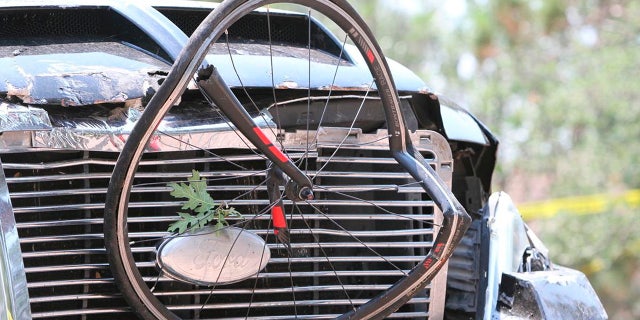 In this Saturday, June 19, 2021, photo courtesy of The White Mountain Independent is a pick up truck which ran over a group of cyclists in Show Low, Ariz.