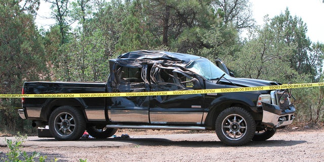 This Saturday, June 19, 2021, photo courtesy of The White Mountain Independent shows a damaged pickup truck which ran over a group of cyclists in Show Low, Ariz. 