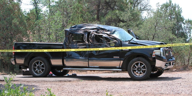 This Saturday, June 19, 2021, photo courtesy of The White Mountain Independent shows a damaged pickup truck which ran over a group of cyclists in Show Low, Ariz.