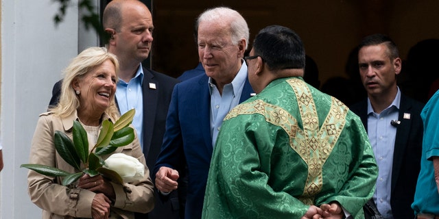 President Joe Biden and first lady Jill Biden speak with a priest as they depart after Mass at St. Joseph on the Brandywine Catholic Church, Saturday, June 19, 2021, in Wilmington, Del. (AP Photo/Alex Brandon)