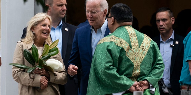 President Joe Biden and first lady Jill Biden speak with a priest as they depart after Mass at St. Joseph on the Brandywine Catholic Church, Saturday, June 19, 2021, in Wilmington, Del. (AP Photo/Alex Brandon)