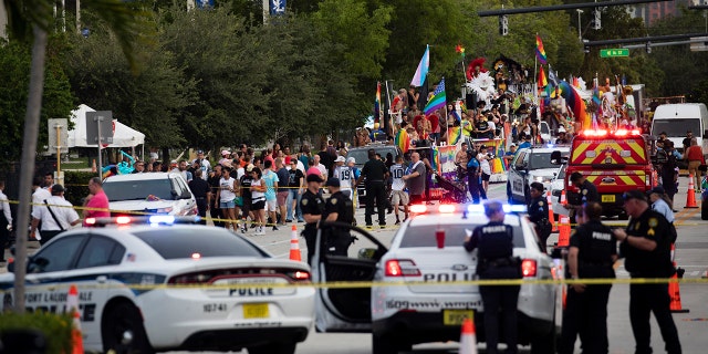 Police and firefighters respond after a truck drove into a crowd of people injuring them during The Stonewall Pride Parade and Street Festival in Wilton Manors, Fla., on Saturday, June 19, 2021. (Associated Press)