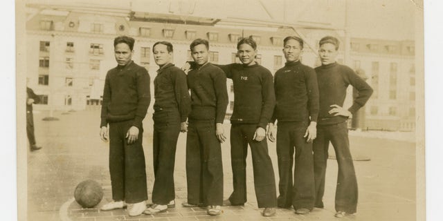 In this 1926 photo provided by the Rita M. Cacas Filipino American Community Archives, University of Maryland, are Filipino sailors in athletic uniforms at US Naval Academy in Annapolis, Maryland. Asian Americans, veterans civilians in the U.S. the Philippines are campaigning to name a Navy warship for a Filipino sailor who bravely rescued two crew members when their ship caught fire more than century ago, earning him a prestigious rare Medal of Honor. (Rita M. Cacas Filipino American Community Archives, University of Marylvia AP)