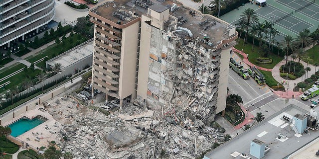 This aerial photo shows part of the 12-story oceanfront Champlain Towers South Condo that collapsed early Thursday, June 24, 2021 in Surfside, Fla.  