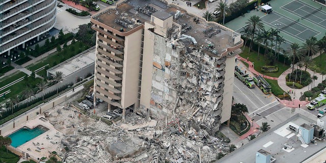 This aerial photo shows part of the 12-story oceanfront Champlain Towers South Condo that collapsed early Thursday, June 24, 2021 in Surfside, Fla.  