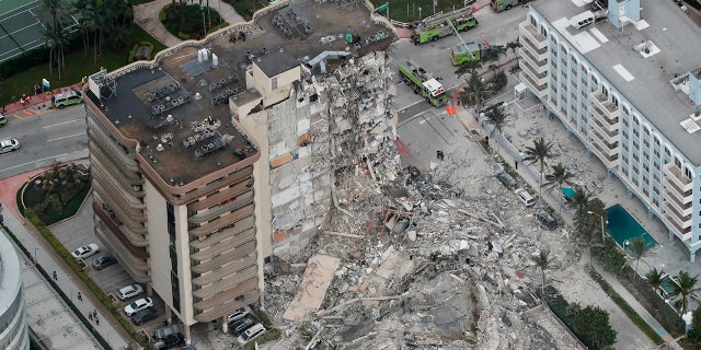 This aerial photo shows part of the 12-story oceanfront Champlain Towers South Condo that collapsed early Thursday, June 24, 2021 in Surfside, Fla.