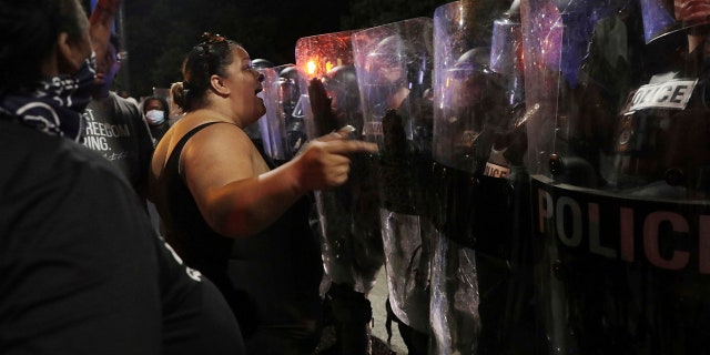 Crystal Bryan of Sumter, S.C. confronts Rock Hill police Wednesday, June 23, 2021, in downtown Rock Hill, S.C. (Associated Press)