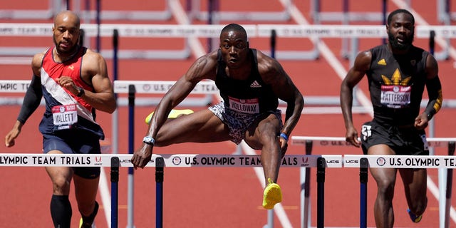 Grant Holloway wins the first heat in the men's 400-meter hurdles at the U.S. Olympic Track and Field Trials Friday, June 25, 2021, in Eugene, Ore. (AP Photo/Ashley Landis)