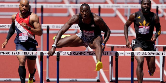 Grant Holloway wins the first heat in the men's 400-meter hurdles at the U.S. Olympic Track and Field Trials Friday, June 25, 2021, in Eugene, Ore. (AP Photo/Ashley Landis)