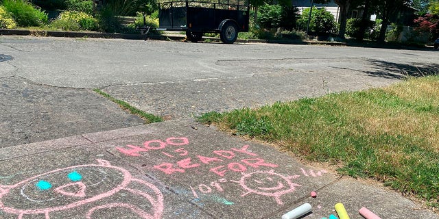 A chalk drawing on the sidewalk in a residential neighborhood in Southeast Portland, Ore., Friday, June 25, 2021, represents a funny take on how hot the temperature is supposed to be during the weekend. The Pacific Northwest sweltered Friday as a historic heat wave hit Washington and Oregon, with temperatures in many areas expected to top out 25 to 30 degrees above normal in the coming days. (AP Photo/Sara Cline)