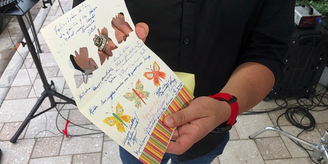 Mike Noriega shows a birthday card, Saturday, June 26, 2021, in Surfside, Fla., relatives sent to his grandmother, Hilda Noriega, two weeks ago for her 92nd birthday. Hilda Noriega lives on the sixth floor of the Miami building that collapsed. (Associated Press)