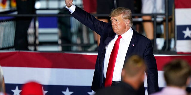 Former President Donald Trump waves to supporters as he leaves the stage after speaking at a rally at the Lorain County Fairgrounds, Saturday, June 26, 2021, in Wellington, Ohio. (AP Photo/Tony Dejak)