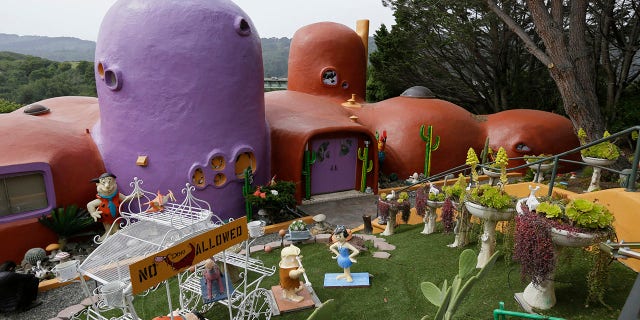 Florence Fang, a retired publishing mogul, first made headlines in 2019 when the town sued her for making alterations to her property, which included putting metal sculptures of dinosaurs in her yard, adding various "Flintstones" related imagery and other additions.