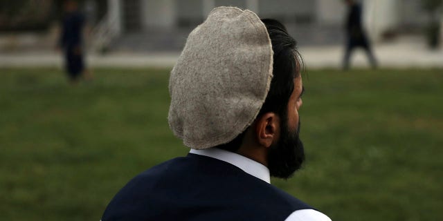 Zabihullah, 30, who spent six years in Bagram prison inside Bagram Air Base accused of crimes he denies, hides his face as he speaks during an interview with the Associated Press in Kabul, Afghanistan, Saturday, June 26, 2021. In 2001 the armies of the world united behind America Bagram Air Base, barely an hours drive from the Afghan capital Kabul, was chosen as the epicenter of Operation Enduring Freedom, as the assault on the Taliban rulers was dubbed. It’s now nearly 20 years later the last US soldier is soon to depart the base. (AP Photo/Rahmat Gul)