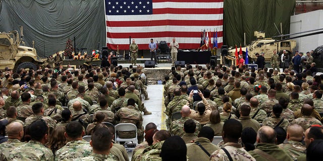 FILE - In this Dec. 24, 2017 file photo, Gen. Joseph Dunford, chairman of the Joint Chiefs of Staff speaks during a ceremony on Christmas Eve at Bagram Air Base, in Afghanistan. In 2001 the armies of the world united behind America and Bagram Air Base, barely an hours drive from the Afghan capital Kabul, was chosen as the epicenter of Operation Enduring Freedom, as the assault on the Taliban rulers was dubbed. It’s now nearly 20 years later and the last US soldier is soon to depart the base. (AP Photo/Rahmat Gul, File)