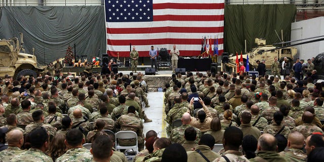 FILE - In this Dec. 24, 2017 file photo, Gen. Joseph Dunford, chairman of the Joint Chiefs of Staff speaks during a ceremony on Christmas Eve at Bagram Air Base, in Afghanistan. In 2001 the armies of the world united behind America and Bagram Air Base, barely an hours drive from the Afghan capital Kabul, was chosen as the epicenter of Operation Enduring Freedom, as the assault on the Taliban rulers was dubbed. It’s now nearly 20 years later and the last US soldier is soon to depart the base. (AP Photo/Rahmat Gul, File)