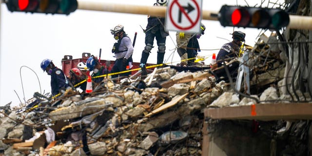 Crews work in the rubble of Champlain Towers South residential condo, Tuesday, June 29, 2021, in Surfside, Fla. Many people were still unaccounted for after Thursday's fatal collapse. (AP Photo/Gerald Herbert)