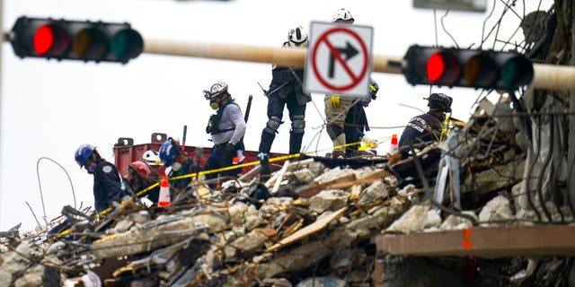 Crews work in the rubble of Champlain Towers South residential condo, Tuesday, June 29, 2021, in Surfside, Fla. Many people were still unaccounted for after Thursday's fatal collapse. (AP Photo/Gerald Herbert)