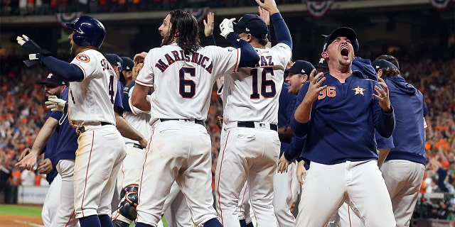 Will Harris #36 of the Houston Astros celebrates with this teammates after winning the ALCS Championship against the New York Yankees in Game 6 of the American League Championship Series at Minute Maid Park on October 19, 2019 in Houston, Texas. (Photo by Bob Levey/Getty Images)