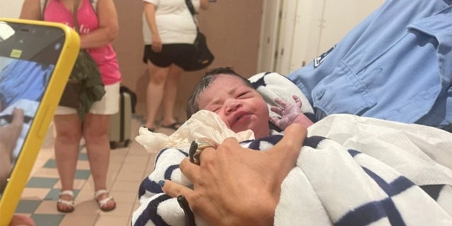 The newborn girl's mother decided to name her Mia, after the airport where she was born. 