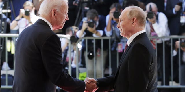 U.S. President Biden (L) and Russia's President Vladimir Putin shake hands as they meet for talks at the Villa La Grange in Geneva June 16, 2021. (Mikhail Metzel/TASS)