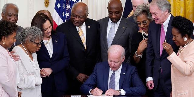 photo of President Biden signing a bill into law