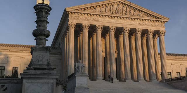  In this Nov. 6, 2020, file photo, the Supreme Court appears at sundown in Washington. (AP Photo/J. Scott Applewhite, File)