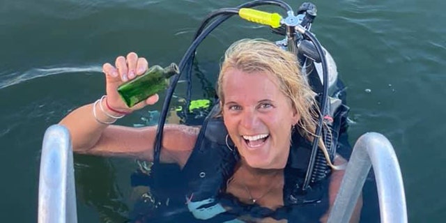 Boat captain Jennifer Dowker found a 95-year-old message in a bottle last week while she was scuba diving on the Cheboygan River. 