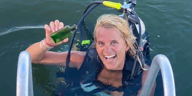 Boat captain Jennifer Dowker found a 95-year-old message in a bottle last week while she was scuba diving on the Cheboygan River.