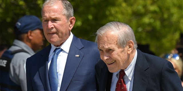 Former US President George W. Bush and Defense Secretary Donald Rumsfeld attend a ceremony to mark the 18th anniversary of the 9/11 attacks, on September 11, 2019, at the Pentagon in Washington, DC. (Photo by MANDEL NGAN / AFP)        (Photo credit should read MANDEL NGAN/AFP via Getty Images)