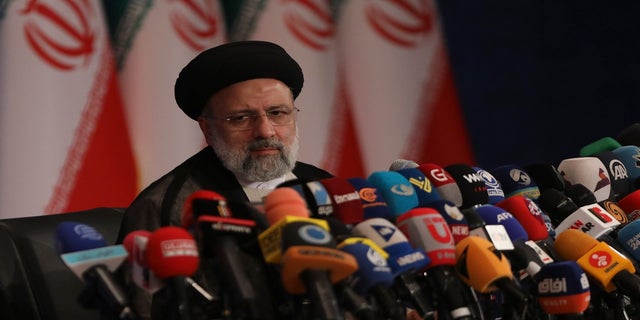 Iran's new President-elect Ebrahim Raisi speaks during a press conference in Tehran, Iran, di lunedi.