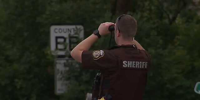 A manhunt was underway in Wisconsin Tuesday following an armed bank robbery in Oconomowoc