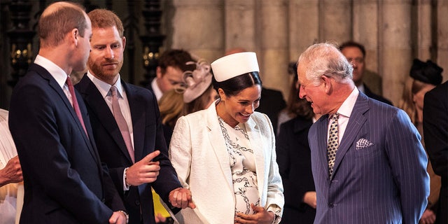 Britain's Meghan, Duchess of Sussex talks with Britain's Prince Charles, Prince of Wales as Britain's Prince William, Duke of Cambridge, talks with Britain's Prince Harry, Duke of Sussex, as they all attend the Commonwealth Day service at Westminster Abbey in London on March 11, 2019.