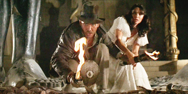 Harrison Ford as Indiana Jones and Karen Allen as Marion Ravenwood.