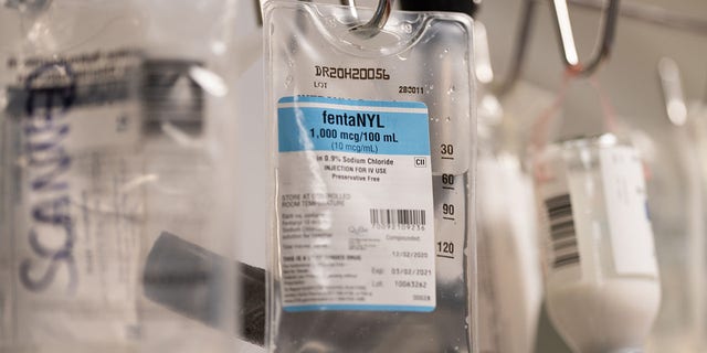 A bag of fentanyl hangs from an intravenous (IV) drip machine in a patient's room at the Covid-19 Intensive Care Unit (ICU) of Sharp Memorial Hospital in San Diego, California, U.S.