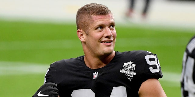 Carl Nassib of the Las Vegas Raiders flexes during warmups before a game against the Denver Broncos at Allegiant Stadium on Nov. 15, 2020 in Las Vegas. The Raiders defeated the Broncos 37-12.  (Photo by Ethan Miller/Getty Images)