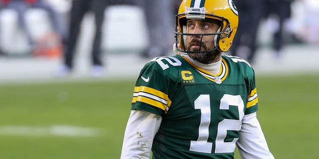 Green Bay Packers' Aaron Rodgers crosses the field in the second quarter against the Tampa Bay Buccaneers during the NFC Championship Game at Lambeau Field on January 24, 2021 in Green Bay, Wisconsin.