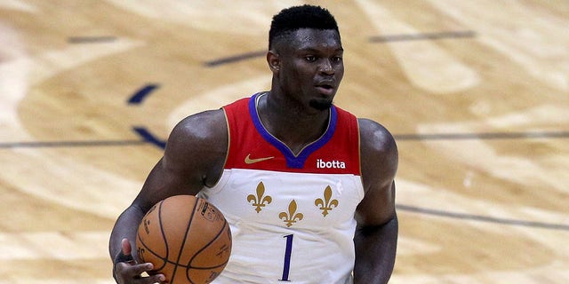 Zion Williamson #1 of the New Orleans Pelicans dribbles the ball downn court during the fourth quarter of an NBA game against the Golden State Warriors at Smoothie King Center on May 04, 2021 in New Orleans, Louisiana.