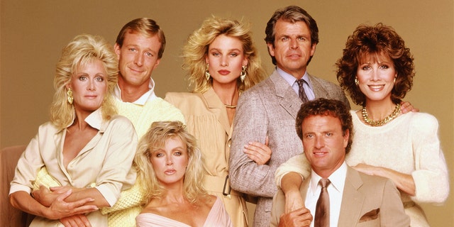 The cast of the American nighttime soap opera series "Knots Landing," from left, Joan van Ark, Ted Shackelford, Donna Mills (seated), Nicollette Sheridan, William Devane, Kevin Dobson and Michele Lee.