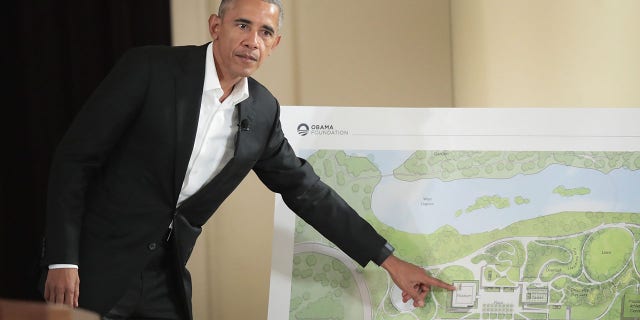 Former President Barack Obama points out features of the proposed Obama Presidential Center