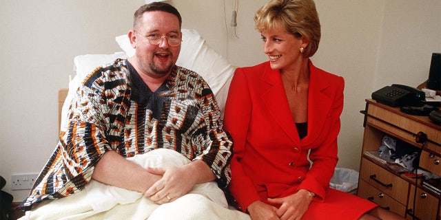 Princess Diana visits a patient at the London Lighthouse, a center for people affected by HIV and AIDS, in London, October 1996.